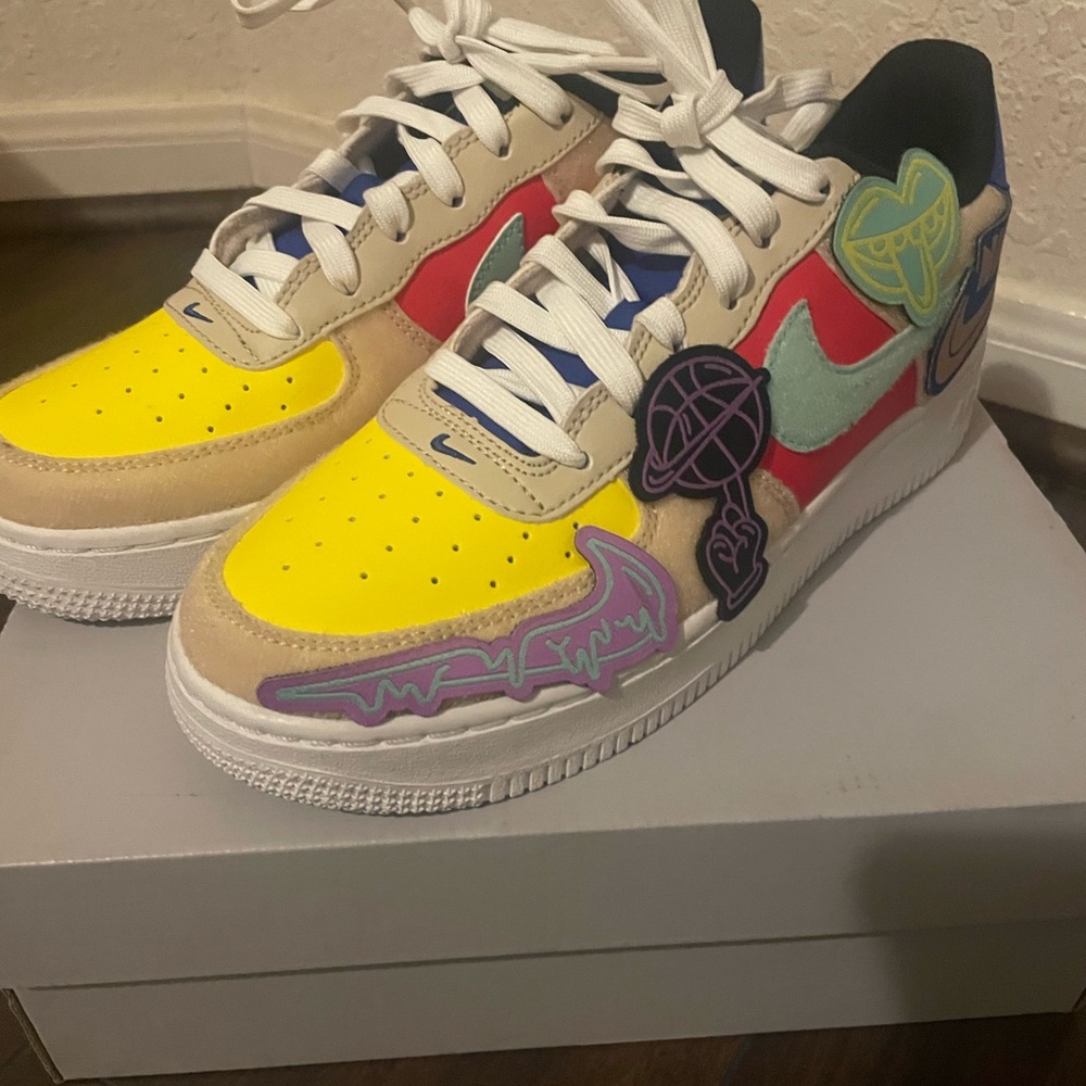 Nike Kids Sneakers with Yellow, Red, and Blue Accents